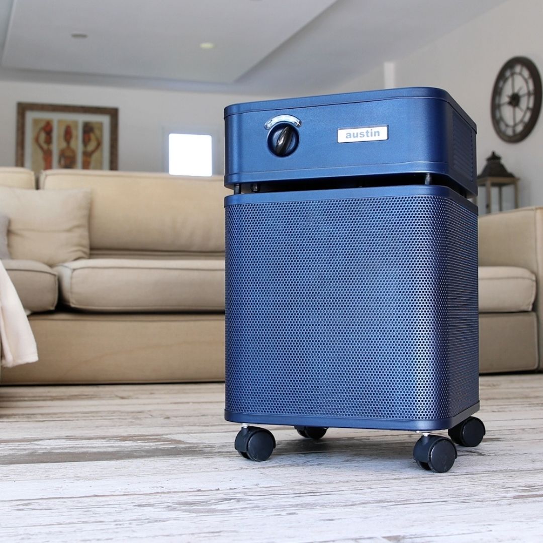 Austin Air HealthMate Plus Air Purifier, Midnight Blue, in a living room